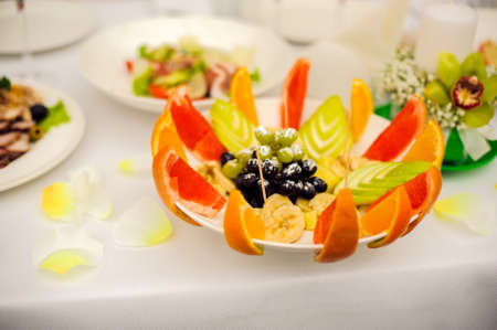 Catering service. Restaurant table with food. Huge amount of food on the table. Plates of food. Dinner time, lunch.の写真素材