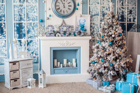 Christmas decor, fireplace and Christmas tree, new year conceptの写真素材