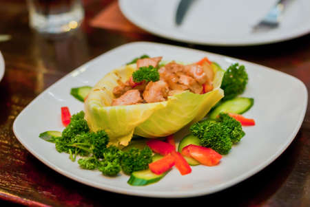 Steak with vegetables on a white plate ready for extraditionの写真素材