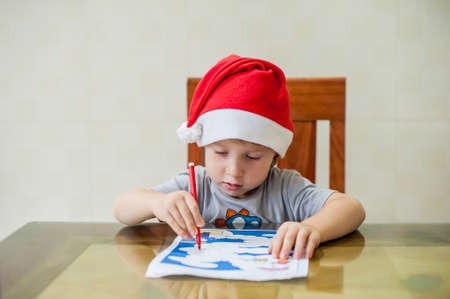 Toddler Boy draws felt pen path in the maze. Early development concept.の写真素材