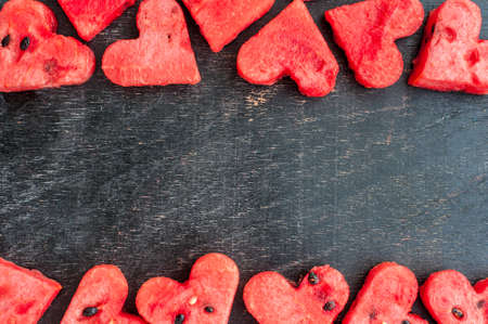Water melon cut into heart shape. Space for text. Flat lay composition. love concept. Valentine's Day Conceptの写真素材