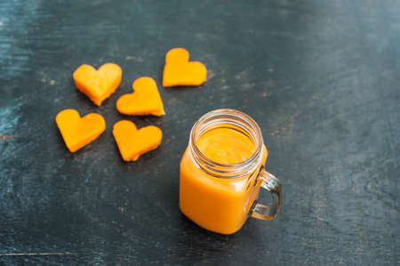 Papaya cutting shape of the heart. Papaya smoothies. The flat lying structure. love concept. Valentine's Day. Healthy food concept.の写真素材