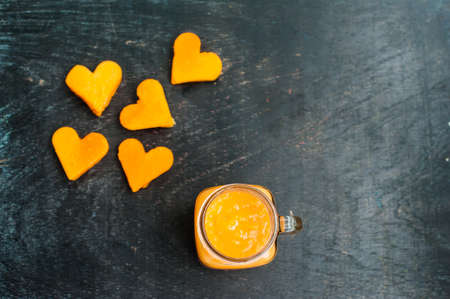 Papaya cutting shape of the heart. Papaya smoothies. The flat lying structure. love concept....