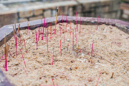 Buddhist prayer sticks inside temple. Incense. Asia Travel concept. Journey through Vietnam Concept.の写真素材