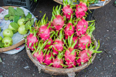 dragon fruit in the wicker basket on the Vietnamese market. Asian food concept.の写真素材