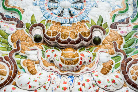 The texture of a wall in a Buddhist temple in Asia ceramic tile. The Colorful of ceramic background texture. Asian background conceptの写真素材