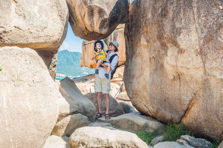 Father and son travelers at the Hon Chong cape, Garden stone, popular tourist destinations at Nha Trang. Vietnam. Asia Travel concept. Journey through Vietnam Concept.の写真素材