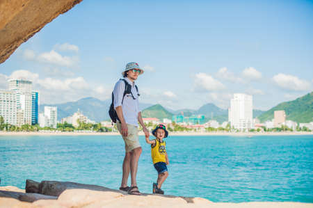 Father and son travelers at the Hon Chong cape, Garden stone, popular tourist destinations at Nha Trang. Vietnam. Asia Travel concept. Journey through Vietnam Concept.の写真素材