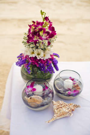 Romantic dinner setting on the beach at sunset. Wedding in the tropics conceptの写真素材