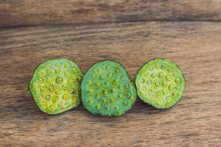 Lotus seeds on an old wooden background.の写真素材