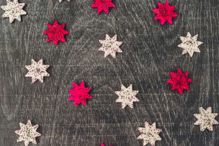 Pieces of sliced dragon fruit in the form of a star on an old withered background.