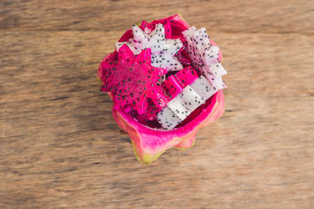 Pieces of sliced dragon fruit in the form of a star on an old withered background.の写真素材