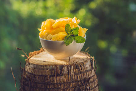 pieces of pineapple on a background of greenery.の写真素材