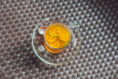 Tangerine tea on a table in a cafe.の写真素材