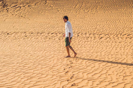 A man lost in the red desert in Vietnam, Mui Ne.の写真素材