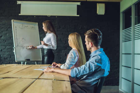 Young, attractive professionals having business training in the officeの写真素材