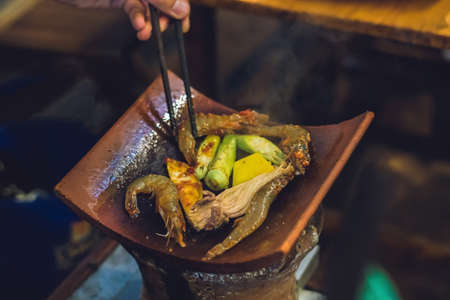 Vietnamese grill. Seafood and vegetables. Street Cafeの写真素材