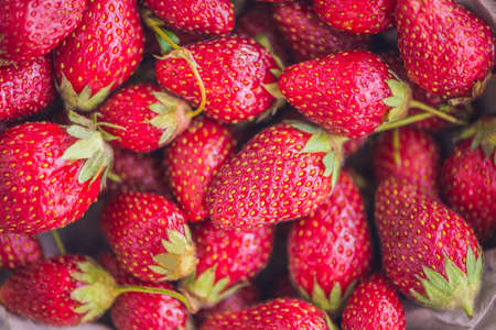 Fresh organic strawberry close-up on an old wooden background.の写真素材