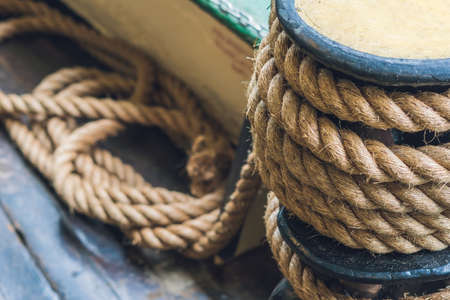 A thick rope on a ship, a ferry for tethering.