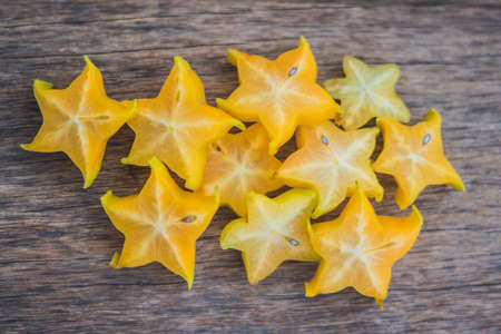 Star fruits on wooden table.の写真素材