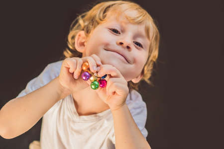 Young boy play with fidget spinner stress relieving toy.の写真素材