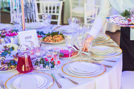 Serving a wedding dinner. Catering service conceptの写真素材