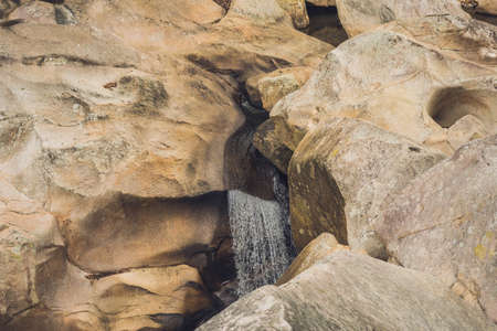 Turquoise water of the mountain river Ganges among white smooth stones. Gangotri. Uttarkashi district.の写真素材