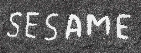 sesame word made from sesame seeds on white artist canvas.