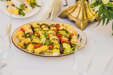 Catering service. Restaurant table with food. Huge amount of food on the table. Plates of food....