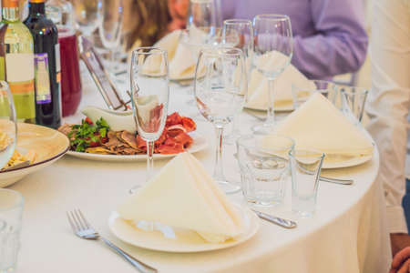Catering service. Restaurant table with food. Huge amount of food on the table. Plates of food. Dinner time, lunch.の写真素材