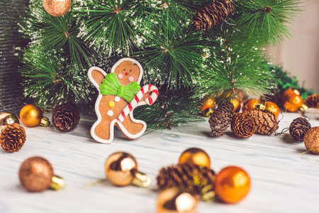 Christmas Decoration Over Wooden Background and gingerbread manの写真素材