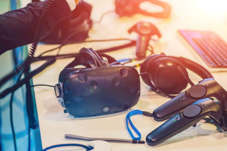 Virtual reality glasses and headphones on the table.