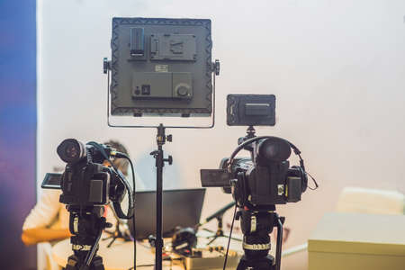 TV NEWS studio with camera and lights.の写真素材