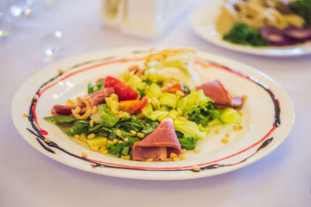 Salad in a plate. Catering service concept.の写真素材