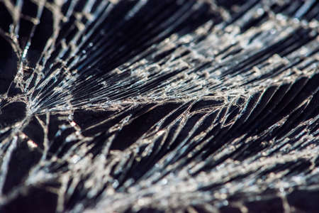 Broken glass - white lines on black background, design element.の写真素材