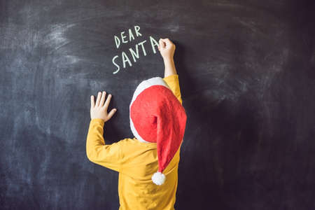 Dear Santa. The boy wrote a message for Santa Claus. Christmas.の写真素材