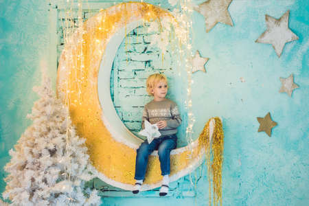 little boy getting ready for the holiday. Happy New Year and Merry Christmas.の写真素材