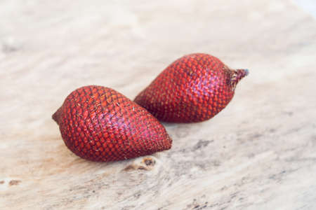 Thailand fruit, Red Fruit Salacca, salak on wooden table.の写真素材
