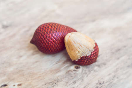 Thailand fruit, Red Fruit Salacca, salak on wooden table.の写真素材