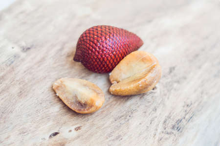 Thailand fruit, Red Fruit Salacca, salak on wooden table.の写真素材