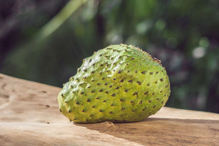 Soursop, Guanabana, Custard Apple, Annona muricata on wooden background