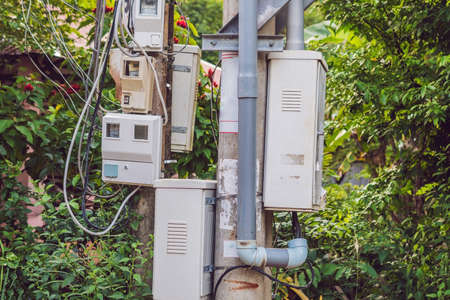 Electric meters on the pillar in Asia.の写真素材