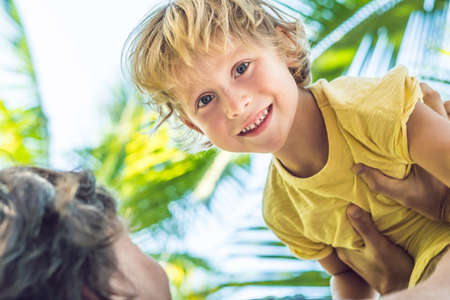 Father and son have fun in the tropics.の写真素材