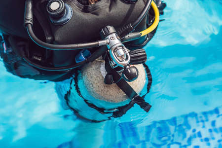 grey scuba diving air oxygen tank on the back of a scuba diver.の写真素材