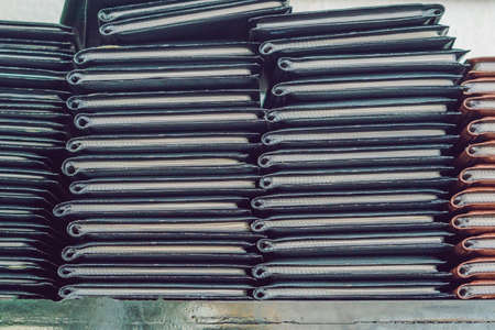 Stack of menus lying on wooden background.の写真素材