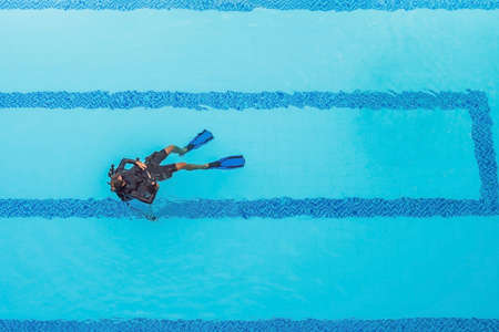 Diving instructor and students. Instructor teaches students to dive.の写真素材