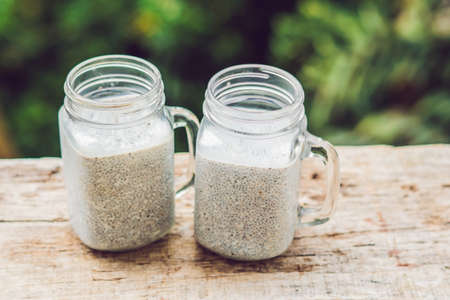 Chia seed pudding with almond milk on a wooden backgroundの写真素材