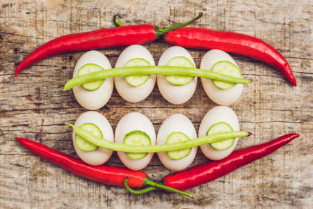 Eggs, peppers, beans and cucumbers in the form of teeth and breakets. varities of orthodontic bracket or brace.の写真素材