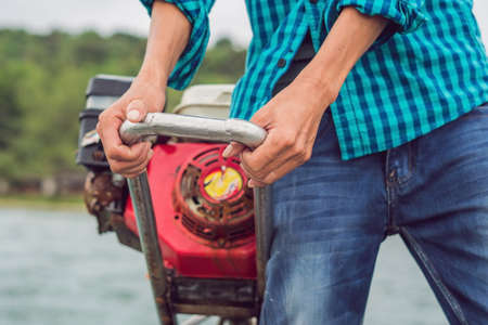 hands of a sailor, drives a motor boat.の写真素材