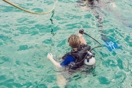Divers on the surface of water ready to dive.の写真素材